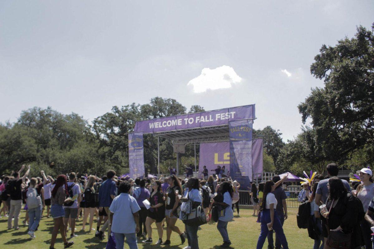 The Fall Fest banner overlooks students and visitors during Fall Fest on Friday, Sept 16, 2022, on the LSU Parade Ground.