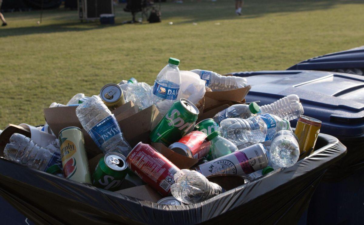 A recycling bin filled with bottles and cans sits on the LSU Parade Ground after tailgating on Saturday, Sept. 24, 2022, in Baton Rouge, La.