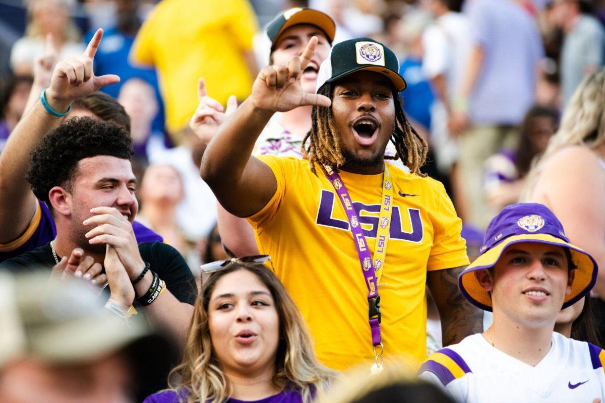 LSU football fans hold up the “L” for LSU after LSU scores a touchdown Saturday, Sept. 17, 2022 during LSU’s 31-16 win against Mississippi State at Tiger Stadium in Baton Rouge, La.