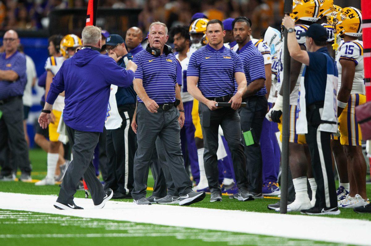 LSU football head coach Brian Kelly speaks with his coaching staff Sunday, Sept. 4, 2022, during LSU's Allstate Kickoff game defeat to Florida State 23-24 in the Caesars Superdome, New Orleans, La.