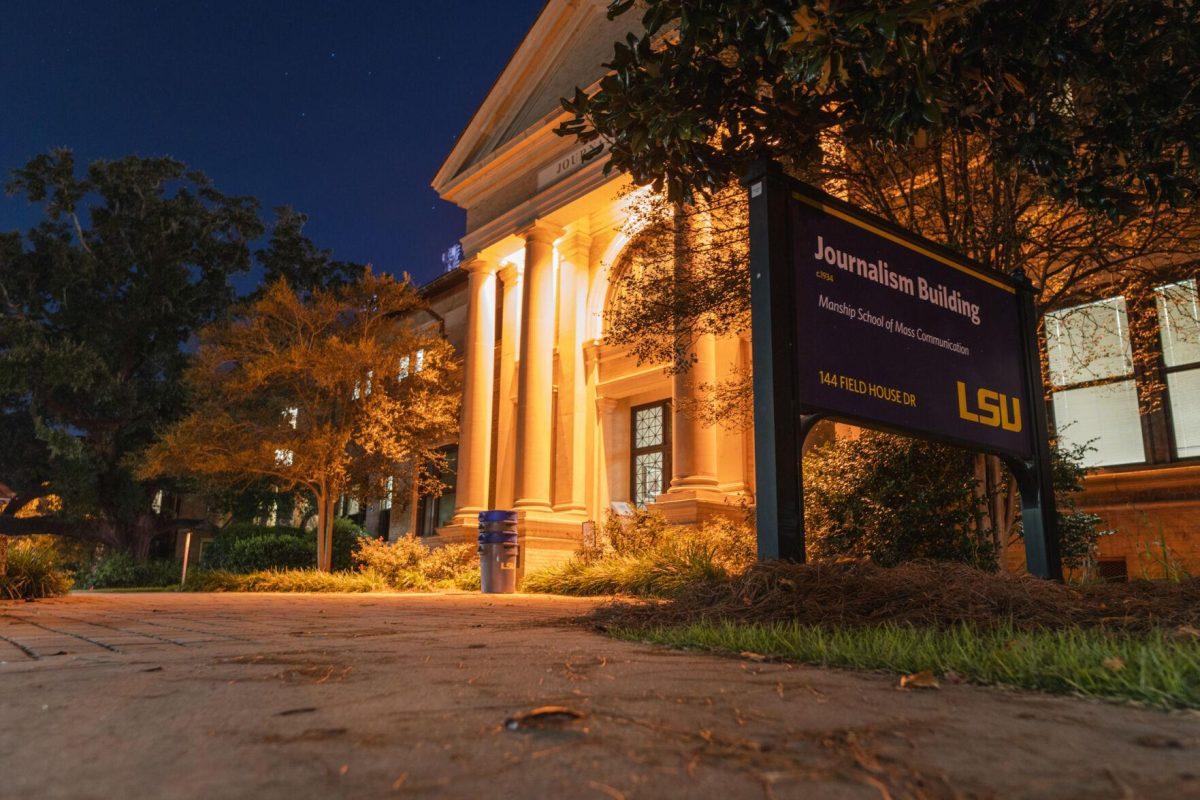 Lights illuminate the Journalism Building&#8217;s main entrance on Tuesday, Sept. 13, 2022, on Field House Drive in Baton Rouge, La.