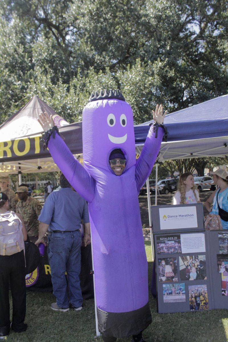 A student dresses as an inflatable tube man a the Dance Marathon booth on Friday, Sept. 16, 2022, during Fall Fest on the LSU Parade Ground.