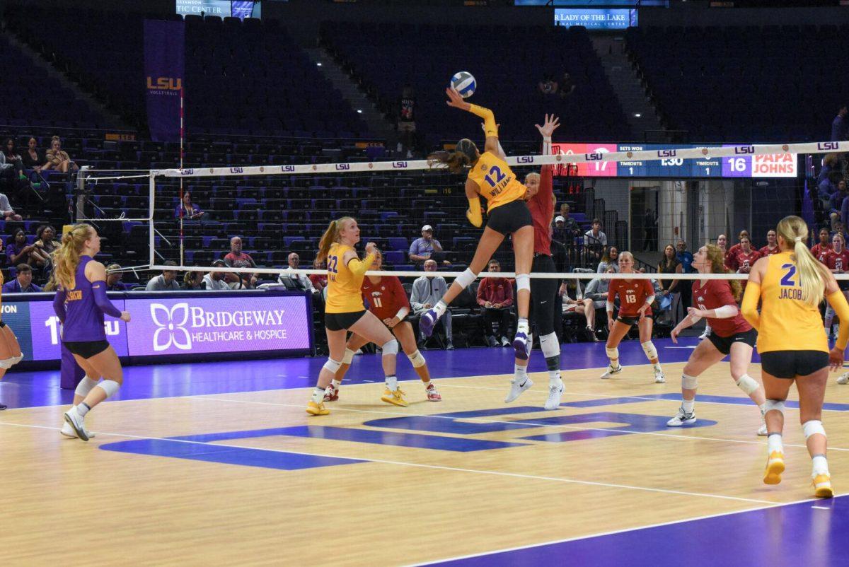 LSU junior Alia Williams hits the ball over the net on Wednesday, Sept. 21, 2022, during LSU&#8217;s 3-2 win over Arkansas at the Pete Maravich Assembly Center in Baton Rouge, La.