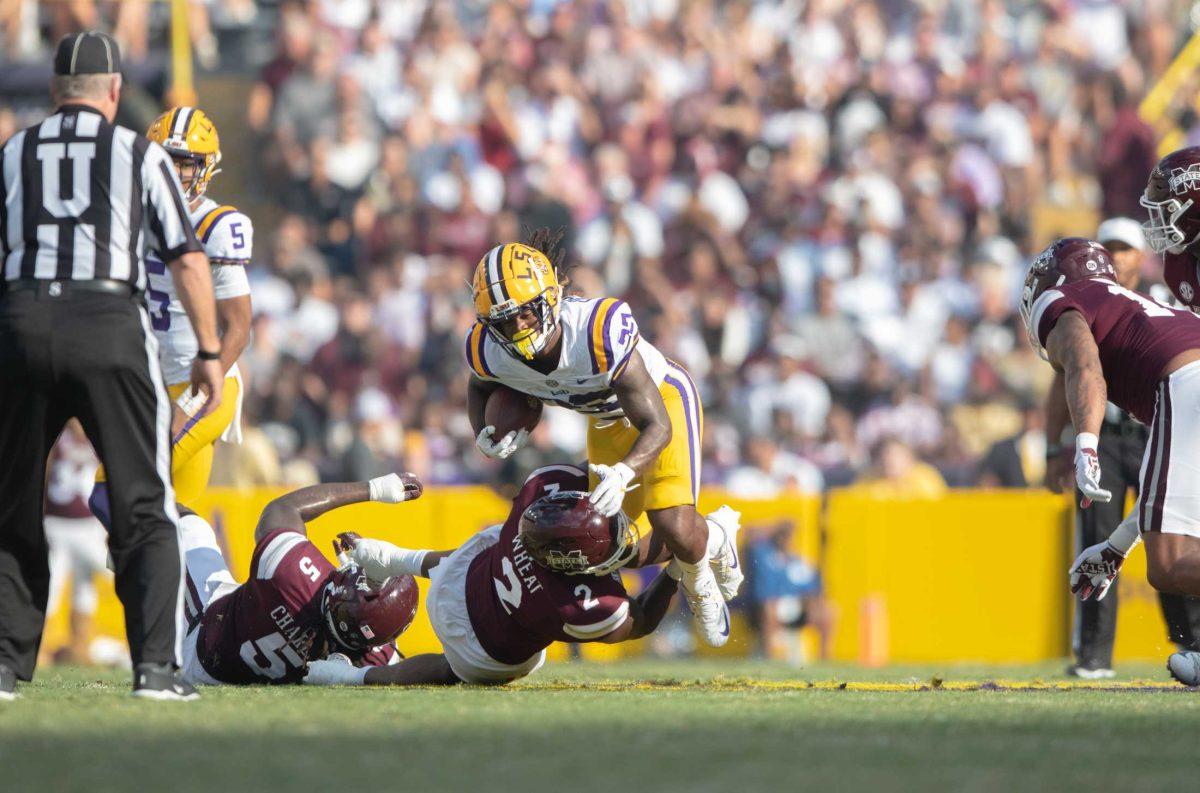 LSU football sophomore running back Armoni Goodwin (22) is taken down by Mississippi State on Saturday, Sept. 17, 2022, during LSU&#8217;s 31-16 win against Mississippi State in Tiger Stadium in Baton Rouge, La.