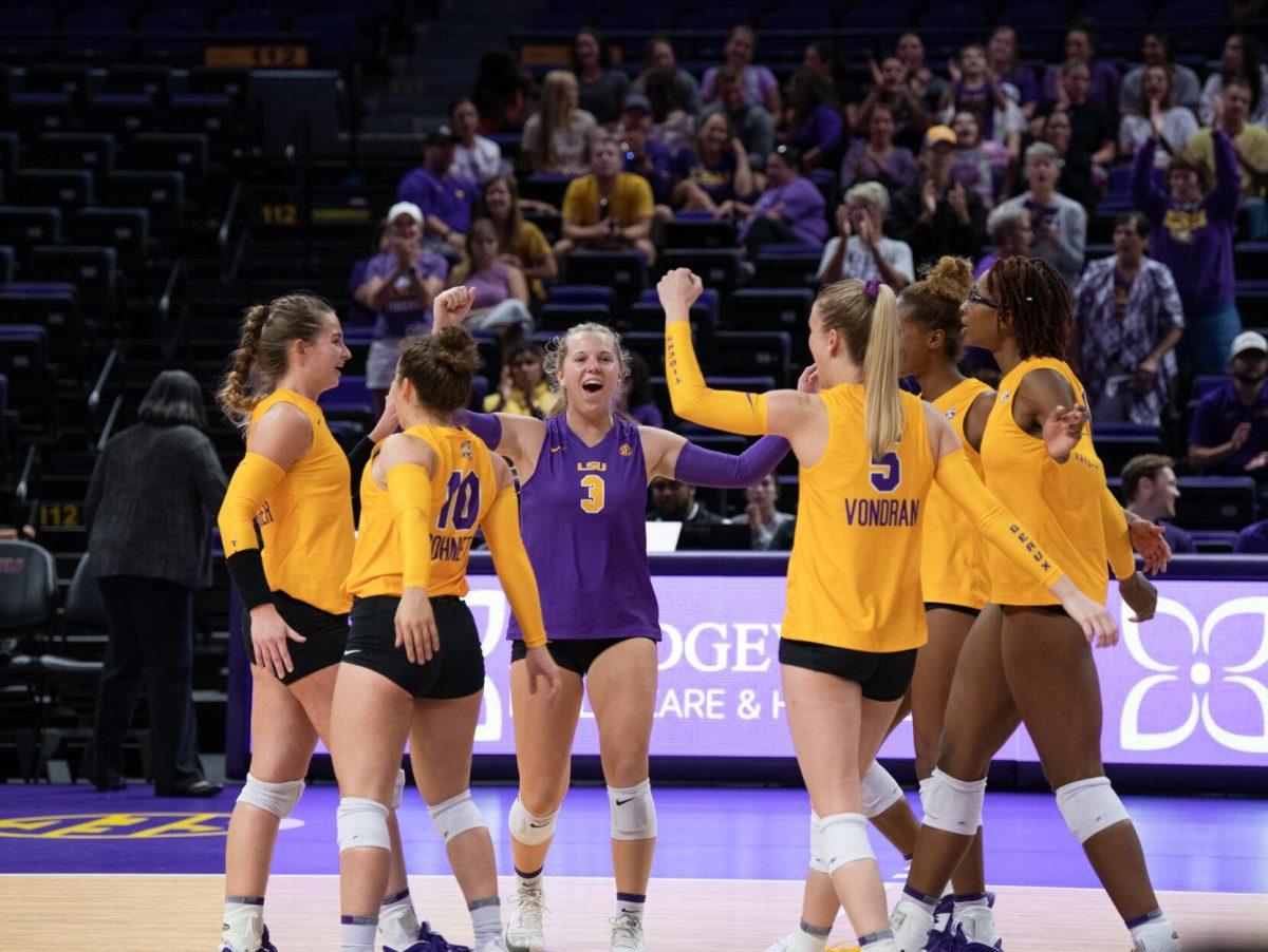 LSU volleyball players celebrate a point on Friday, Sept. 2, 2022, during LSU&#8217;s 3-0 victory over Iowa State in the Pete Maravich Assembly Center in Baton Rouge, La.