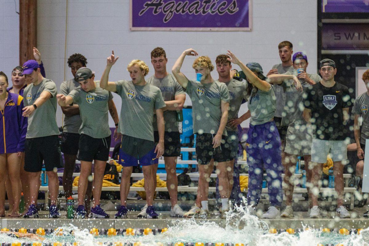 The LSU swim team cheers for their teammates on Friday, Sept. 23, 2022, during LSU&#8217;s victory over Tulane and Vanderbilt at the LSU Natatorium on Nicholson Drive in Baton Rouge, La.