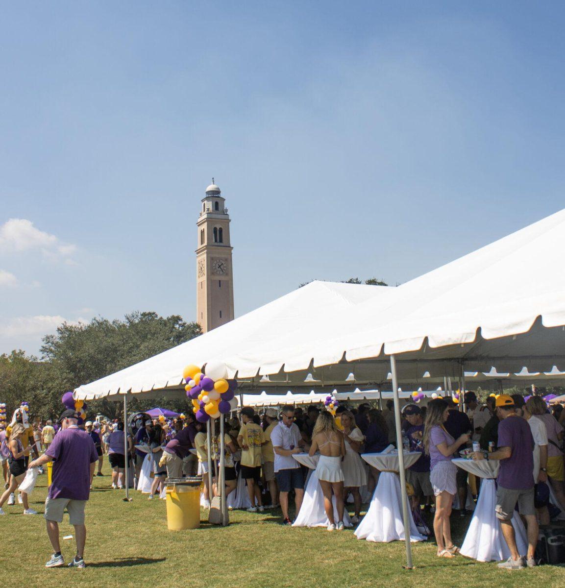 Visitors and students stand under tents at the LSU Family Weekend Tailgate on Saturday, Sept. 24, 2022, on the LSU Parade Ground in Baton Rouge, La.