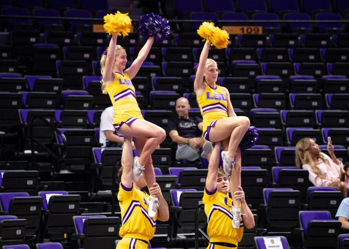 LSU cheerleaders are lifted into the air on Friday, Sept. 2, 2022, during LSU&#8217;s 3-0 victory over Iowa State in the Pete Maravich Assembly Center in Baton Rouge, La.