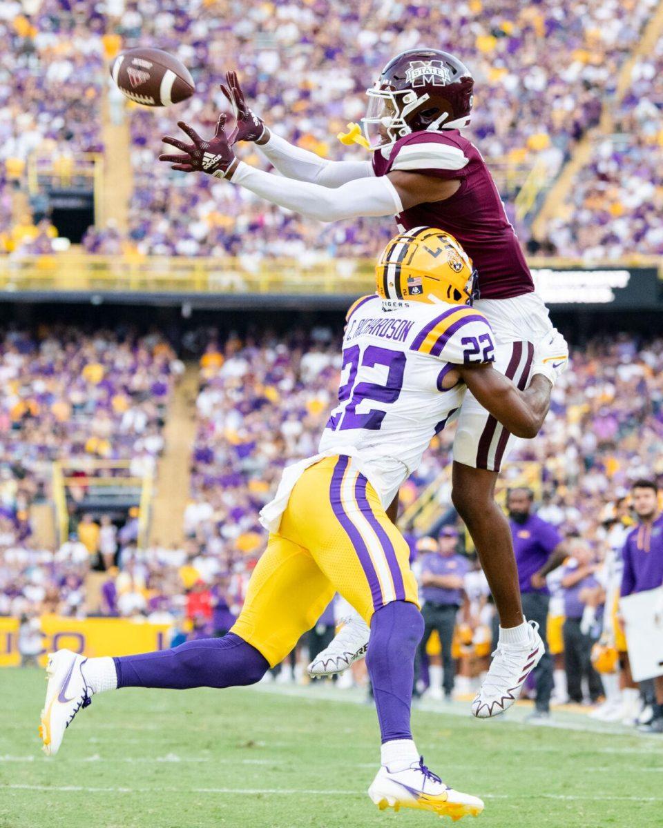LSU football graduate student defensive back Colby Richardson (22) attempts to defend Mississippi State sophomore wide receiver Rara Thomas (0) as he catches the ball Saturday, Sept. 17, 2022 during LSU’s 31-16 win against Mississippi State at Tiger Stadium in Baton Rouge, La. 