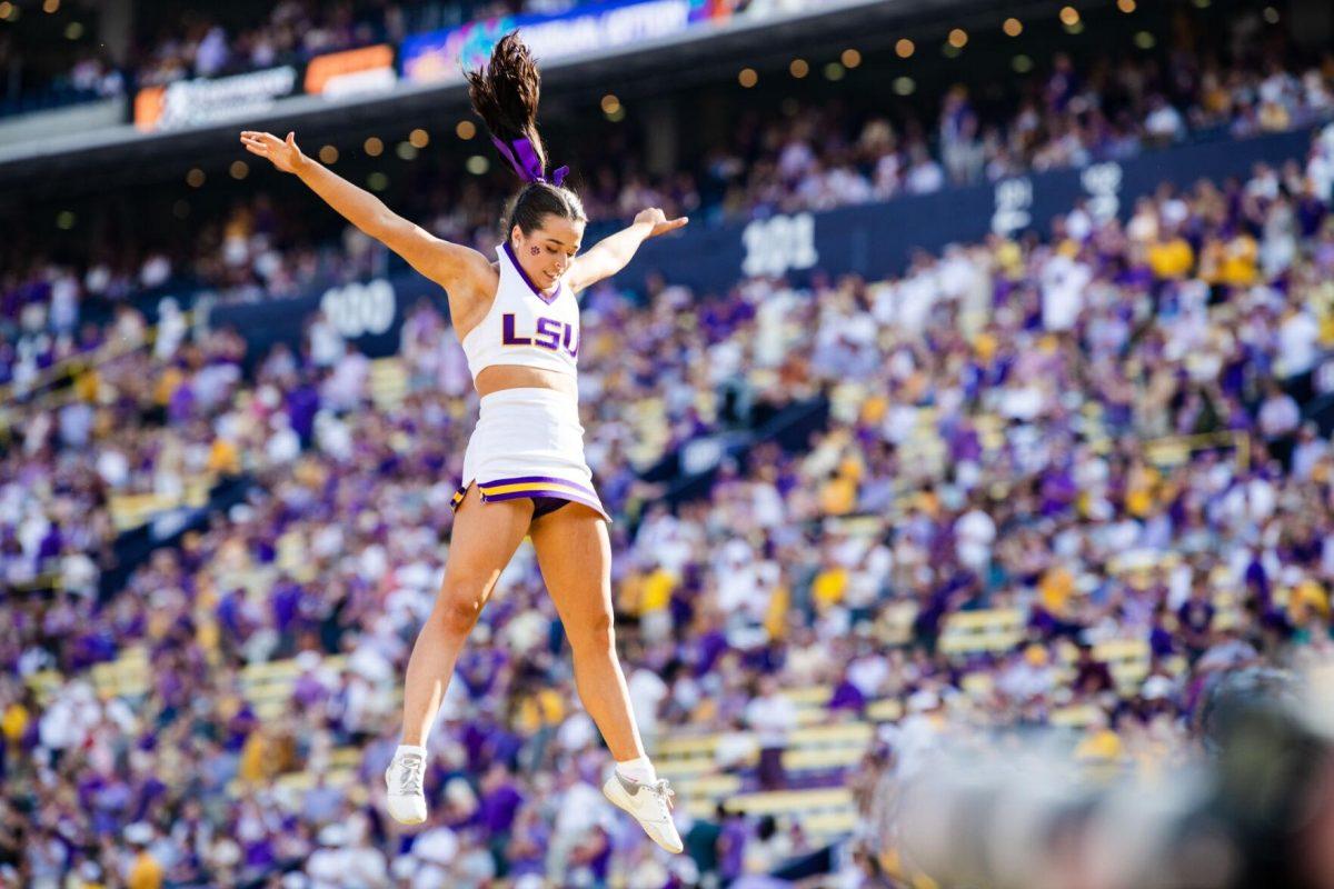 A LSU cheerleader flies through the air Saturday, Sept. 17, 2022 before LSU’s 31-16 win against Mississippi State at Tiger Stadium in Baton Rouge, La.
