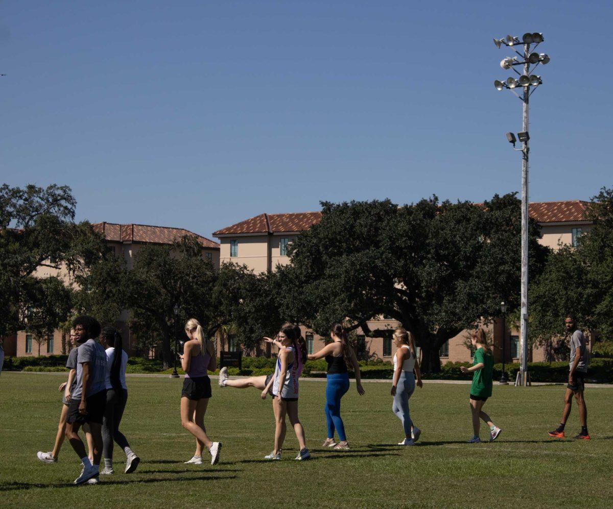 A jogging class goes through warmups on Wednesday, Sept. 14, 2022, at the field by the LSU Natatorium in Baton Rouge, La.