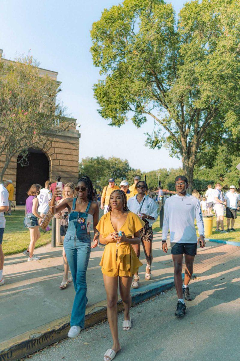 A group walks down Victory Hill on Saturday, Sept. 11, 2021 toward Tiger Stadium for the LSU vs. McNeese State game in Baton Rouge, La.