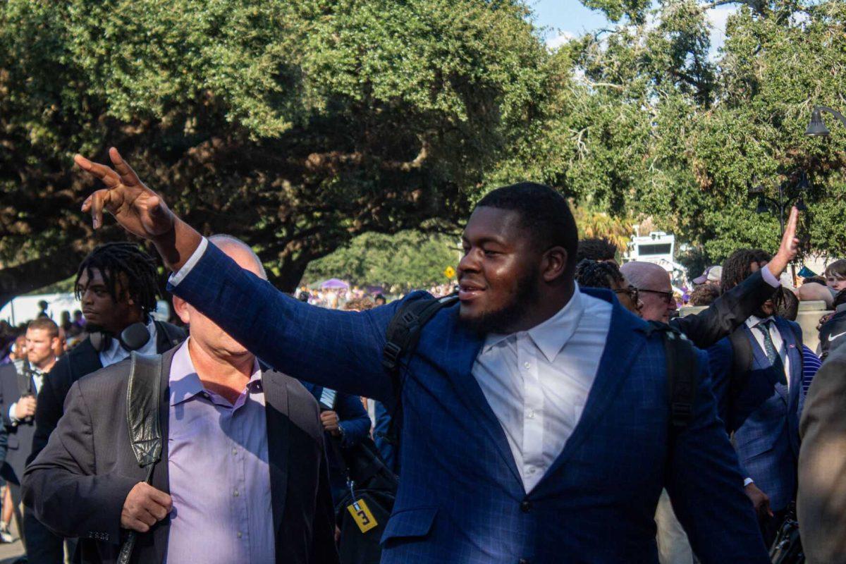 LSU football player waves to fans on Saturday, Sept. 24, 2022, prior to the LSU vs New Mexico game on North Stadium Drive.