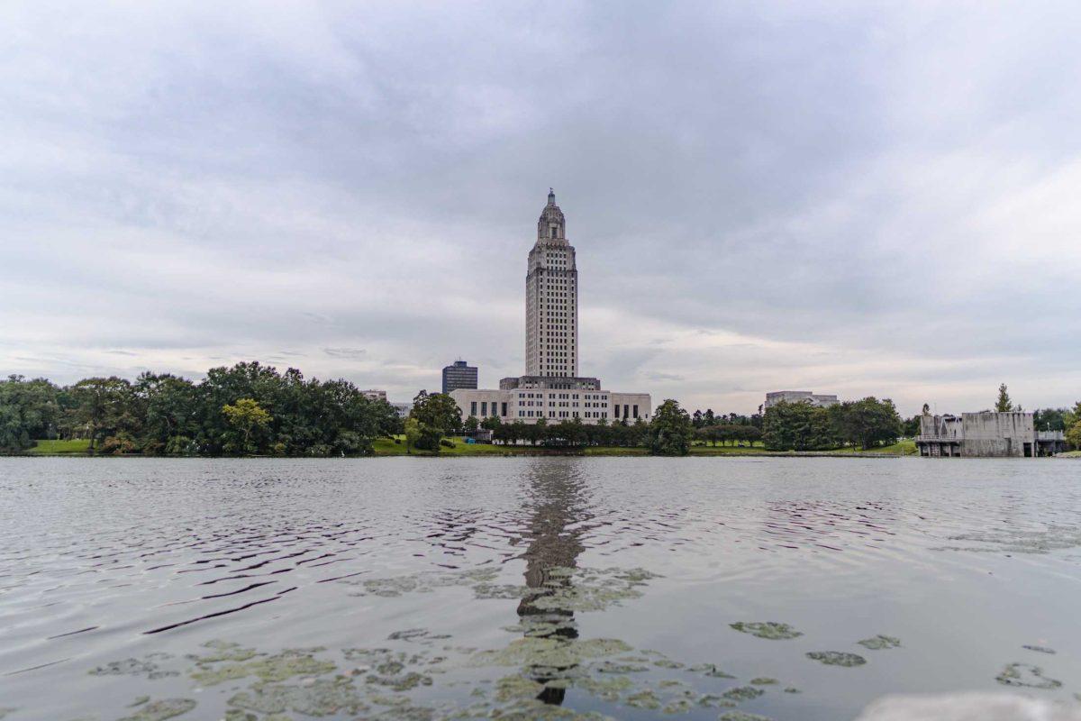 Waves distort the Capitol&#8217;s reflection on Monday, Aug. 22, 2022, on North 3rd Street in Baton Rouge, La.