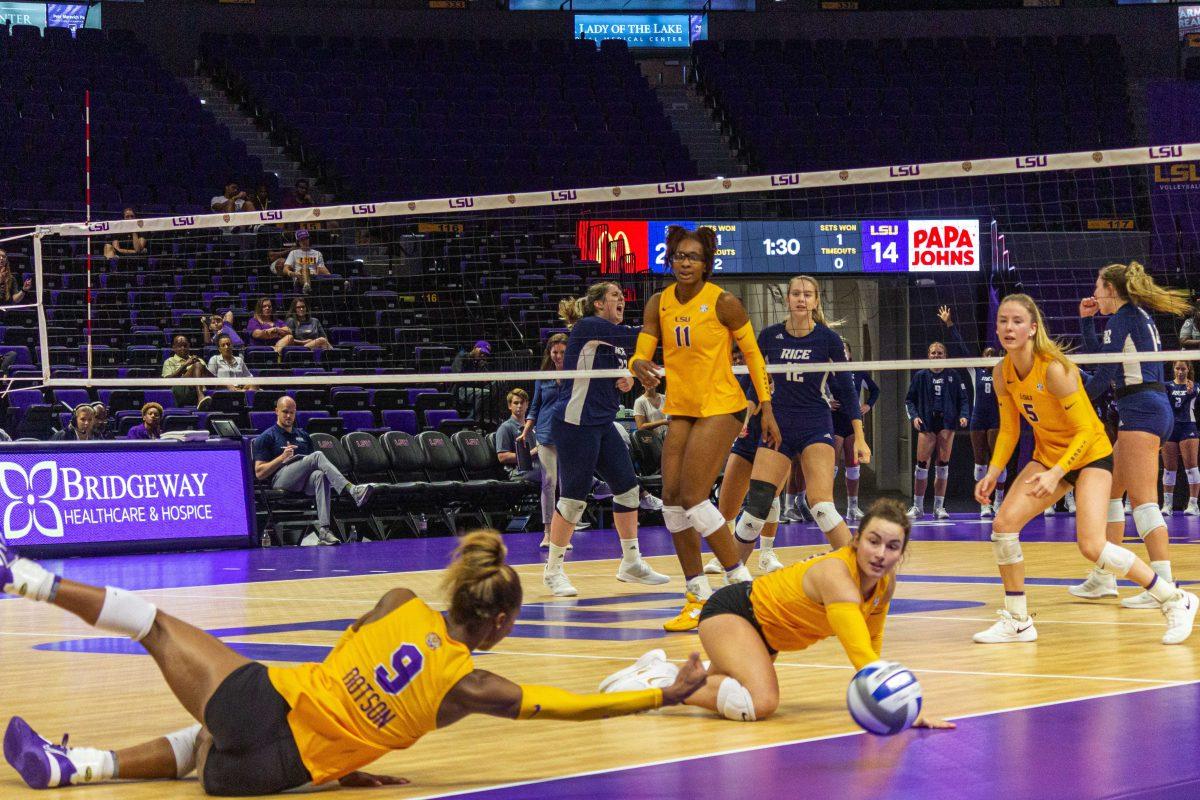 LSU volleyball players watch as the ball hits the ground as Rice players celebrate Saturday, Aug. 27, 2022, during LSU's 2-3 defeat to Rice in the Pete Maravich Assembly Center on N. Stadium Drive in Baton Rouge, La.