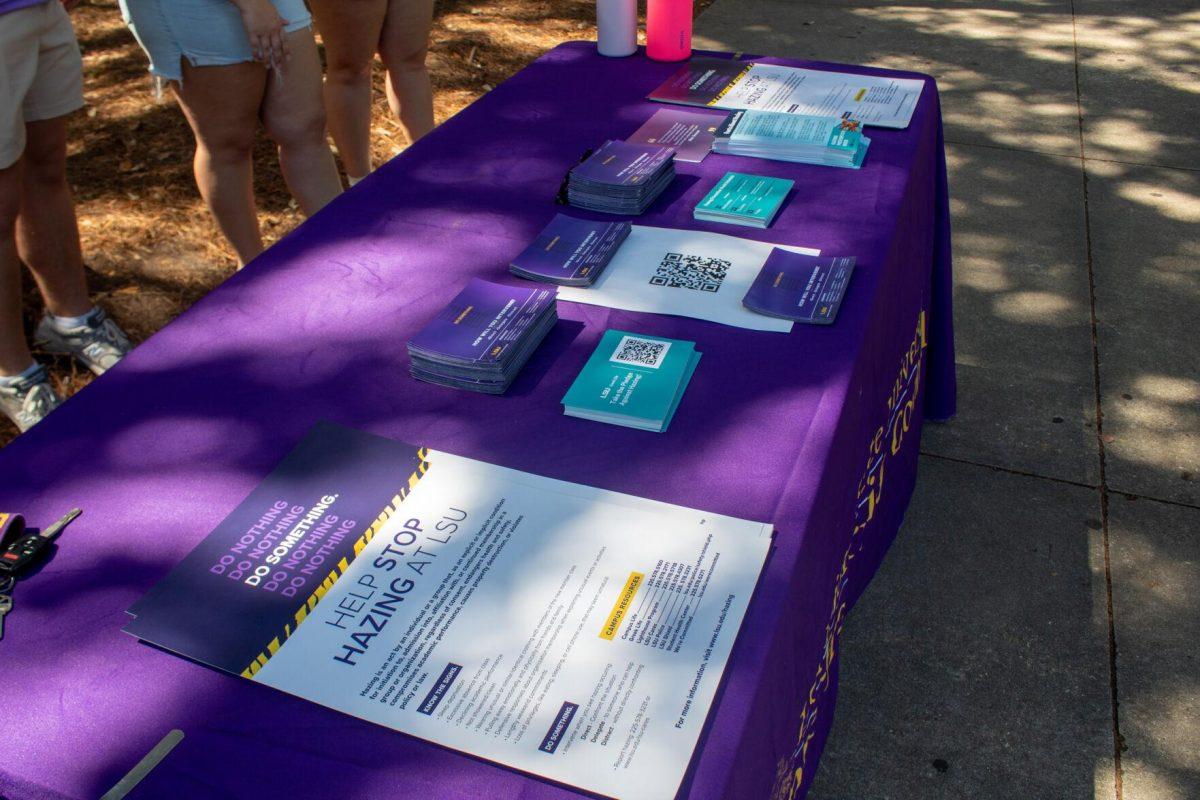 The Infraternity Council's table is lined with informational flyers on Hazing Prevention Week on Tuesday, Sept 20, 2022, in Free Speech Alley on LSU's Campus.