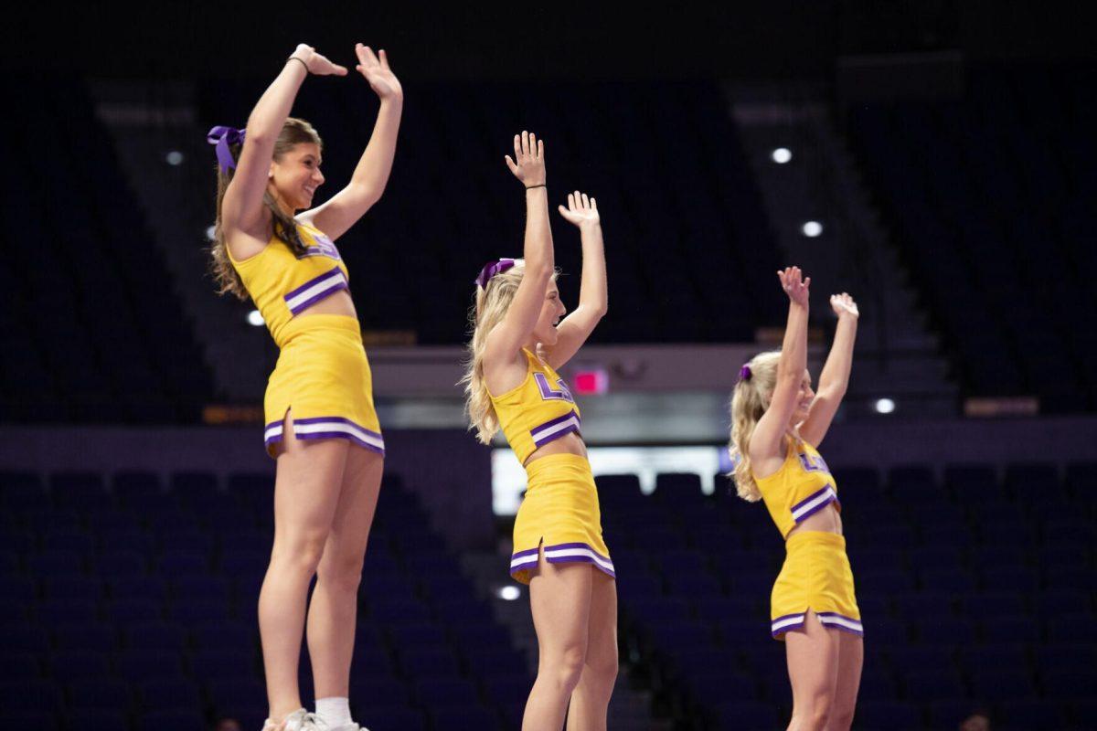 LSU cheerleaders are lifted into the air on Friday, Sept. 2, 2022, during LSU&#8217;s 3-0 victory over Iowa State in the Pete Maravich Assembly Center in Baton Rouge, La.