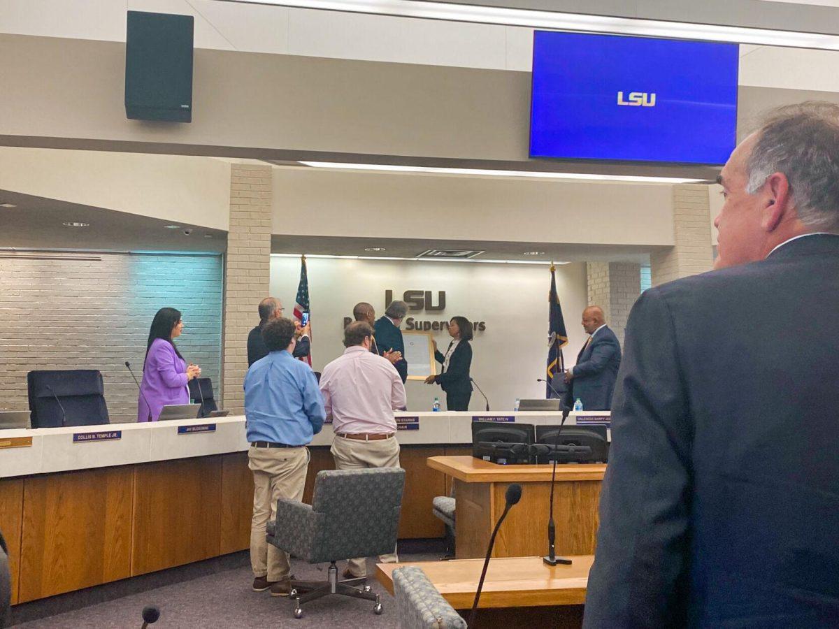 Valencia Sarpy Jones recognizes Remy Voisin Starns for his service as chairman of the Board of Supervisors during their September meeting on Friday, September 9, 2022.