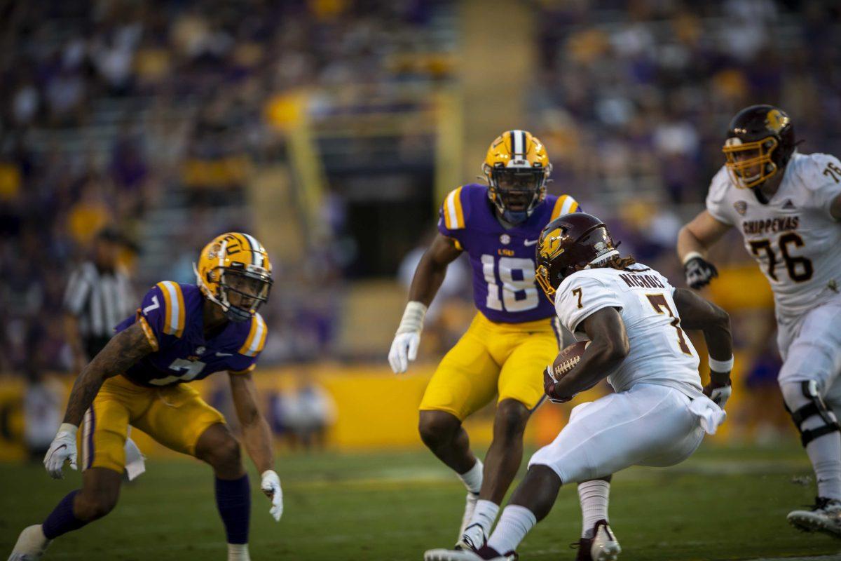 LSU football junior cornerback Derek Stingley Jr. (7) and senior linebacker Damone Clark (18) stare down Central Michigan football freshmen runningback Lew Nicholis III (7) Saturday, Sept. 18, 2021, during the LSU vs Central Michigan game in Tiger Stadium.