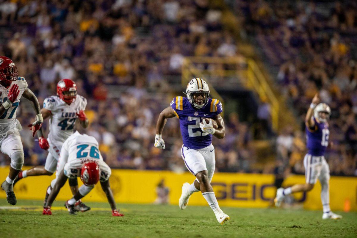 LSU football junior running back Noah Cain (21) runs the ball on Saturday, Sept. 24, 2022, during the LSU vs New Mexico game in Tiger Stadium&#160;in Baton Rouge, La.