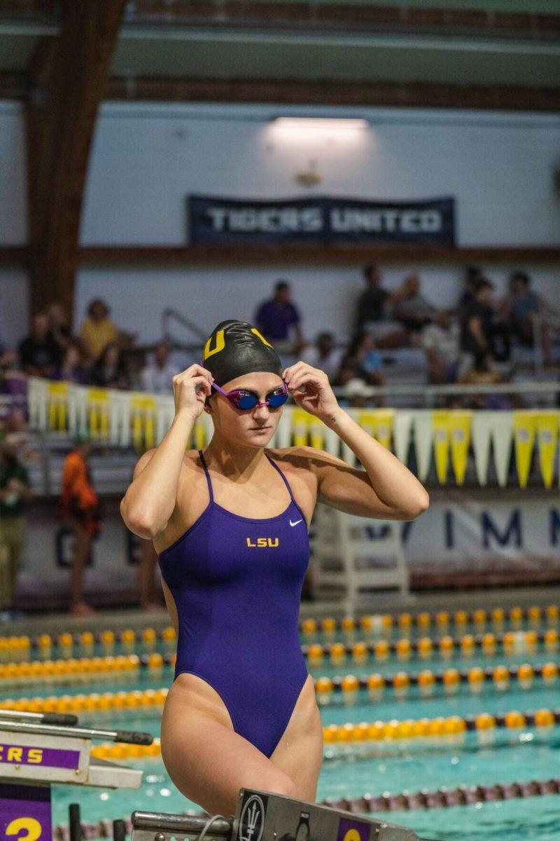 LSU swim butterfly junior Hannah Bellina adjusts her goggles on Friday, Sept. 23, 2022, during LSU&#8217;s victory over Tulane and Vanderbilt at the LSU Natatorium on Nicholson Drive in Baton Rouge, La.