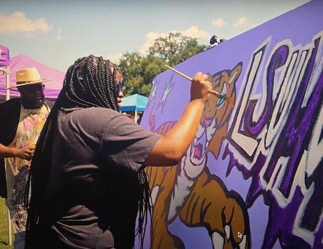 A mural is painted at the Free Art Making booth hosted by the College of Art + Design at Fall Fest on Friday, Sep. 16. Photo by LSU.