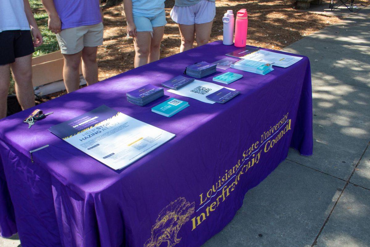 The Infraternity Council's table sits with informational flyers about Hazing Prevention Week atop of it on Tuesday, Sept 20, 2022, in Free Speech Alley on LSU's Campus.