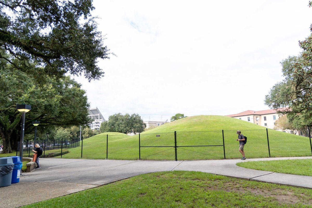 Students walk by the LSU Indian Mounds Thursday, Aug. 25, 2022, on LSU's campus.