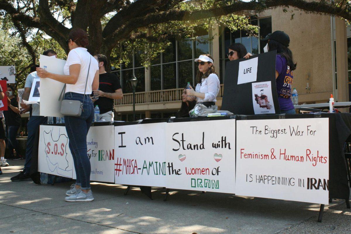 "Woman, life, freedom," is called by advocates for the situation in Iran in Free Speech Alley on Sept. 23, 2022.