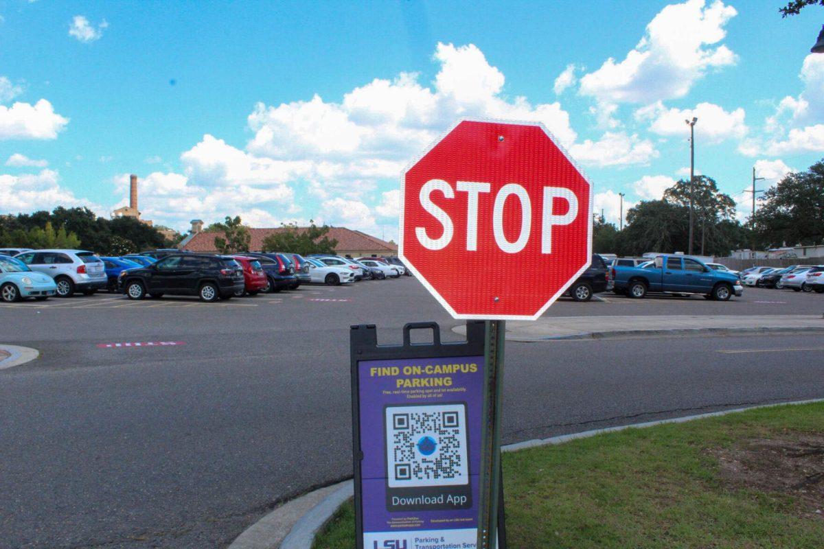 A QR code for finding more parking in commuter lots sits next to a stop sign in an LSU commuter lot on Friday, Aug. 2nd, 2022, in Baton Rouge, La.