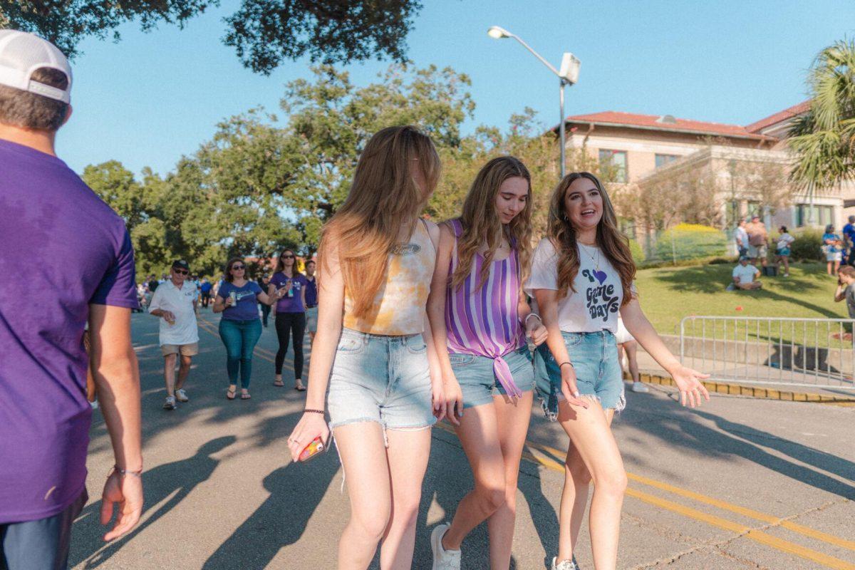 A trio of girls walks down Victory Hill on Saturday, Sept. 11, 2021, prior to LSU's win over McNeese State at Tiger Stadium in Baton Rouge, La.