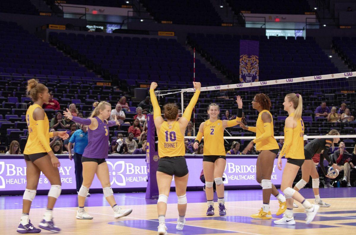 LSU volleyball players celebrate a point on Friday, Sept. 2, 2022, during LSU&#8217;s 3-0 victory over Iowa State in the Pete Maravich Assembly Center in Baton Rouge, La.