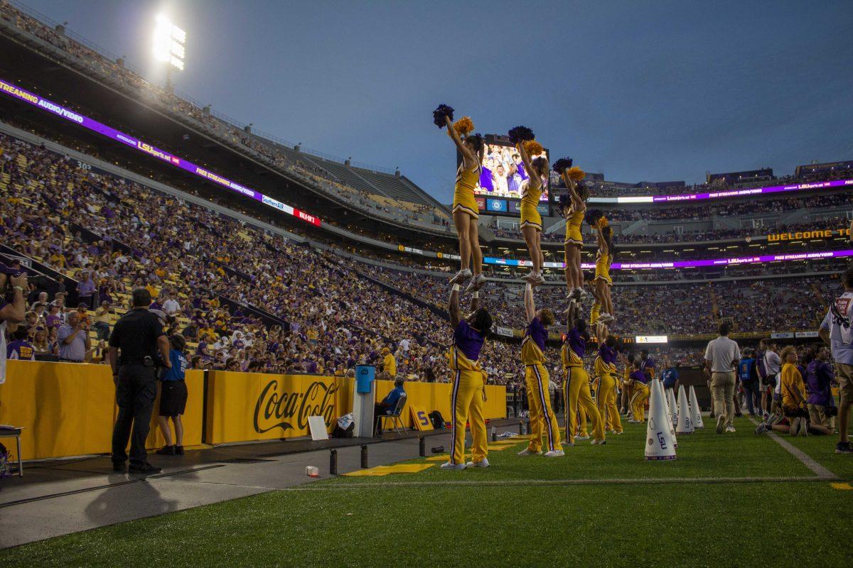 LSU cheerleaders energize the crowd Saturday, Sept. 18, 2021, while leading a cheer during the LSU vs Central Michigan football game in Tiger Stadium.