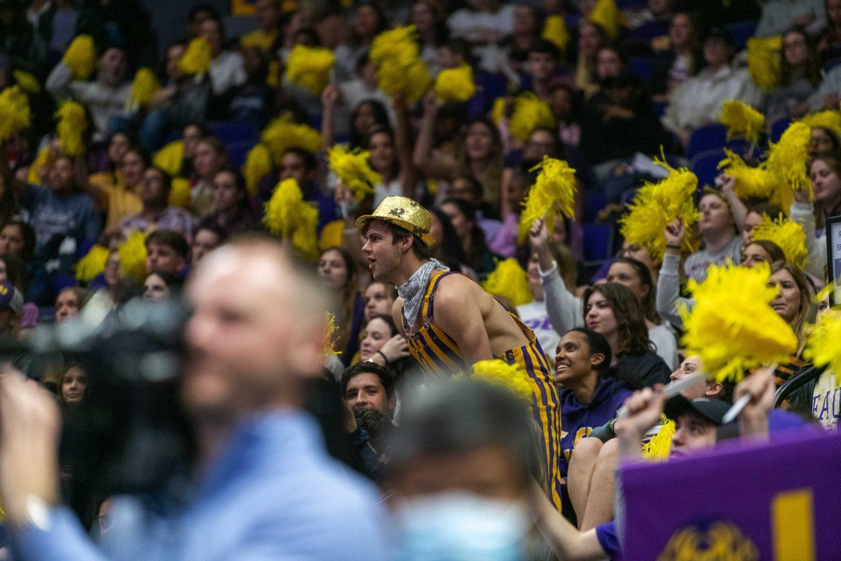 <p>LSU mechanical engineering junior Sayer Sauviac rallies the crowd Friday, March 11, 2022 during LSU's 198.125-197.875 win over University of Utah in the Pete Maravich Assembly Center on N. Stadium Drive in Baton Rouge, La.</p>