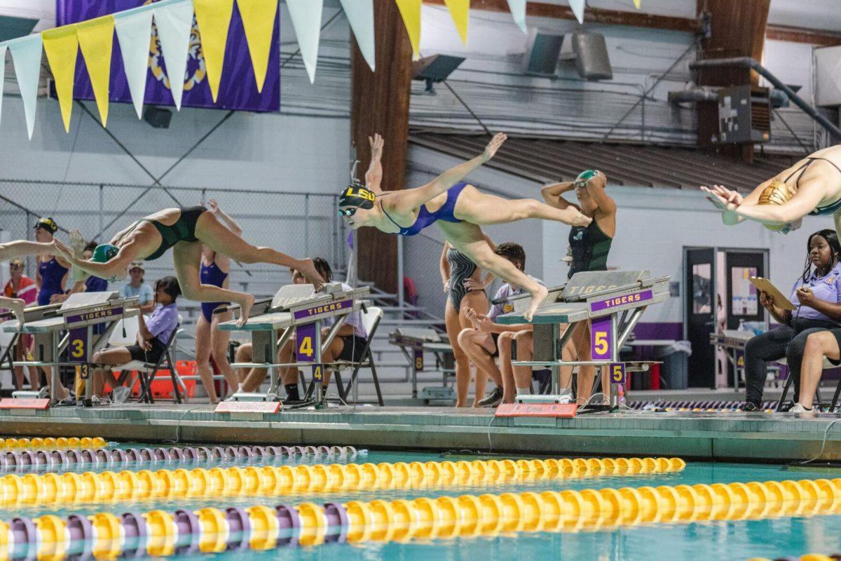 LSU swim freestyle graduate student Maggie MacNeil dives into the pool on Friday, Sept. 23, 2022, during LSU&#8217;s victory over Tulane and Vanderbilt at the LSU Natatorium on Nicholson Drive in Baton Rouge, La.