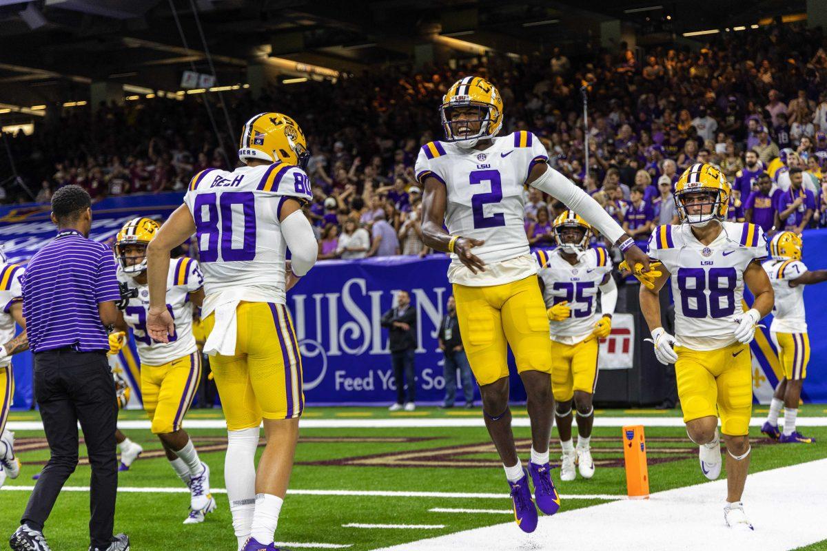 LSU football junior center back Mekhi Garner (2) jumps with excitment along with sophomore wide receiver Jack Bech (80) Sunday, Sept. 4, 2022, during LSU's Allstate Kickoff game defeat to Florida State 23-24 in the Caesars Superdome, New Orleans, La.