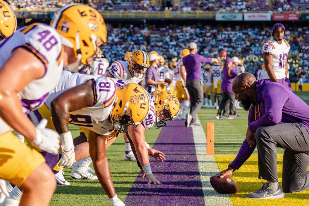 LSU defensive line coach Jamar Cain leads the team in warmups on Saturday, Sept. 10, 2022, before LSU&#8217;s 65-17 win over Southern at Tiger Stadium in Baton Rouge, La.