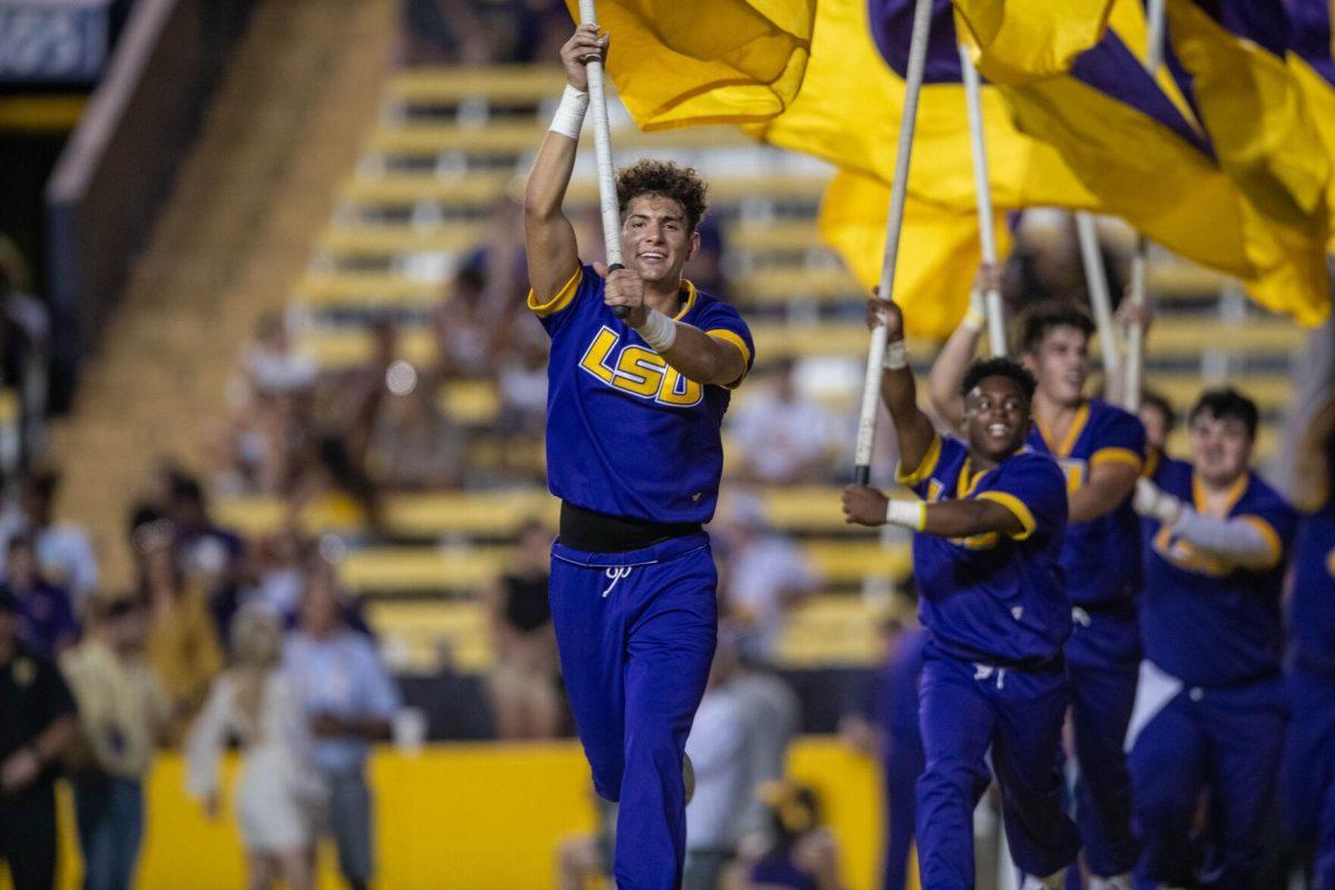 Cheerleaders run flags around the endzone after LSU touchdown on Saturday, Sept. 24, 2022, during the LSU vs New Mexico game in Tiger Stadium.