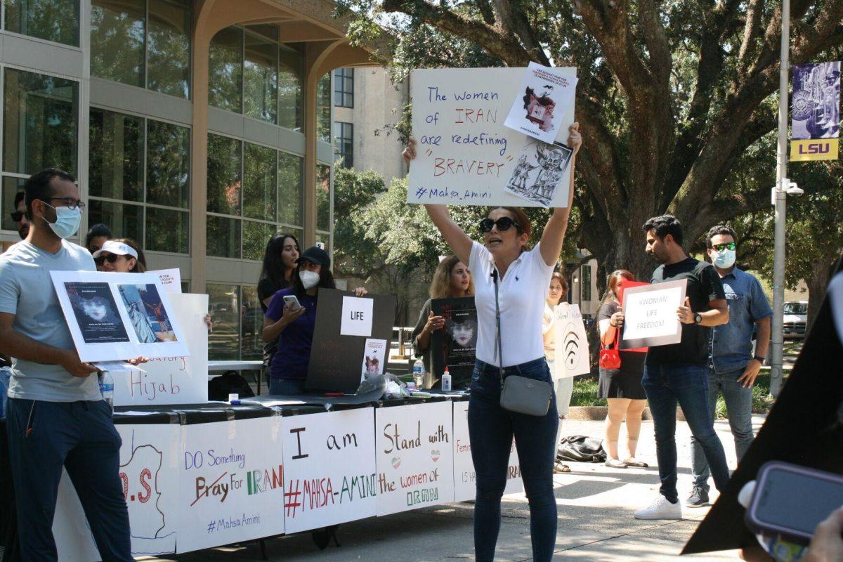 "Woman, life, freedom," is called by advocates for the situation in Iran in Free Speech Alley on Sept. 23, 2022.