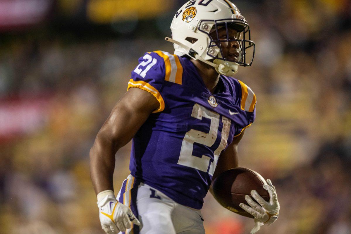 LSU football junior running back Noah Cain (21) runs with the ball on Saturday, Sept. 24, 2022, during the LSU vs New Mexico game in Tiger Stadium.