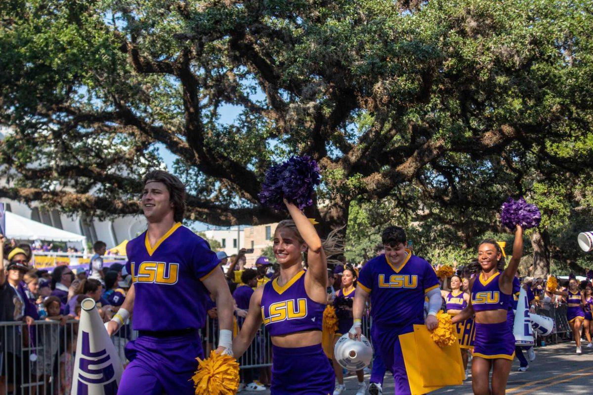 Cheerleaders wave at fans while running down Victory on Saturday, Sept. 24, 2022, prior to the LSU vs New Mexico game on North Stadium Drive&#160;&#160;in Baton Rouge, La.