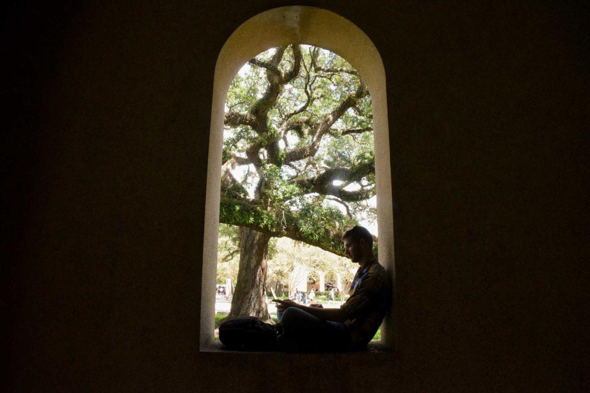 LSU History senior Alexander Dunaway sits on Monday, Aug. 29, 2022, in the Quad, Baton Rouge, La.