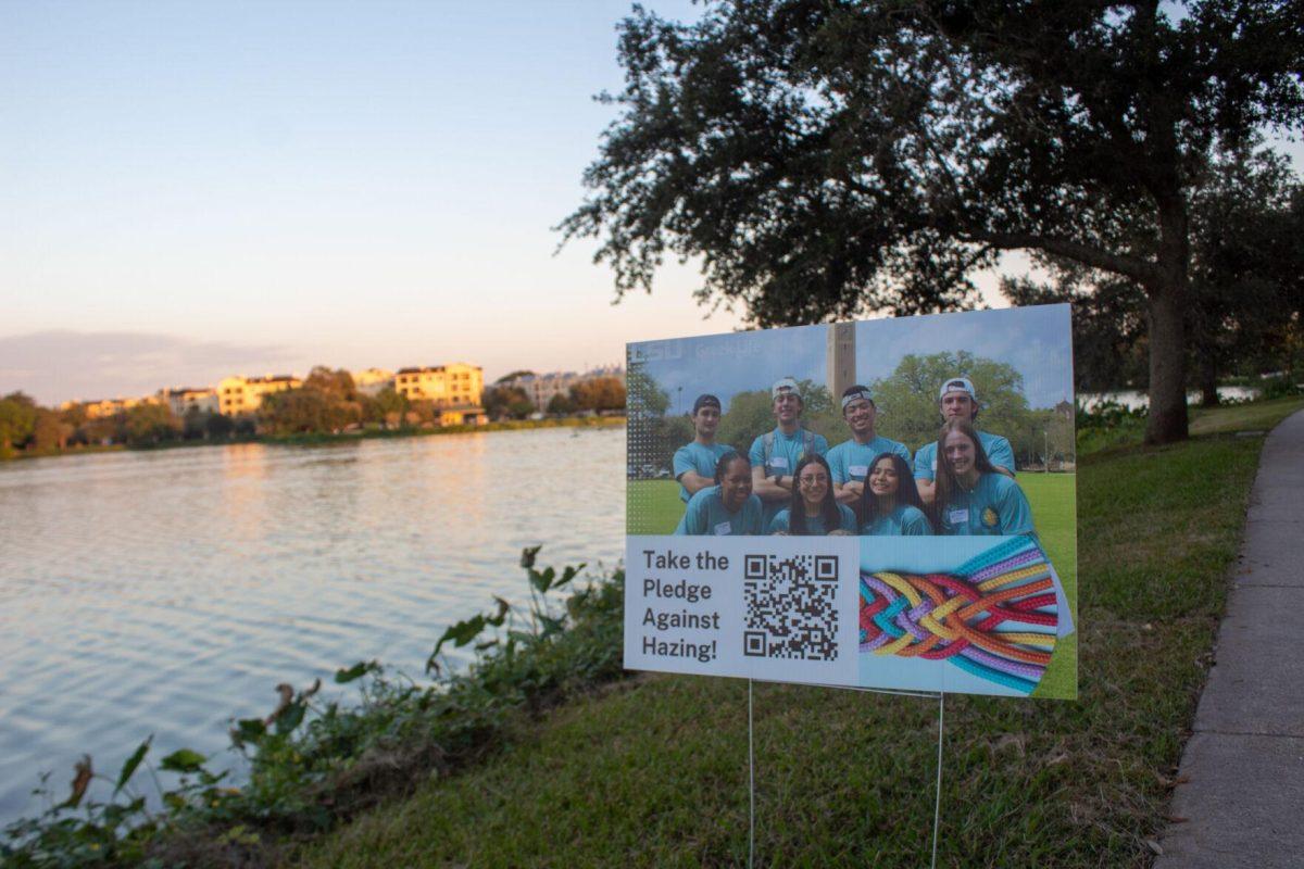 Signs line the lakes for students to take the pledge against hazing by scanning the QR codes on Thursday, Sept. 22, 2022 on W Lakeshore Drive in Baton Rouge.