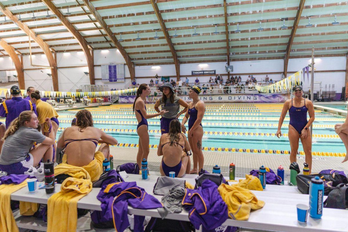 LSU swimmers relax during a break in the meet on Friday, Sept. 23, 2022, during LSU&#8217;s victory over Tulane and Vanderbilt at the LSU Natatorium on Nicholson Drive in Baton Rouge, La.