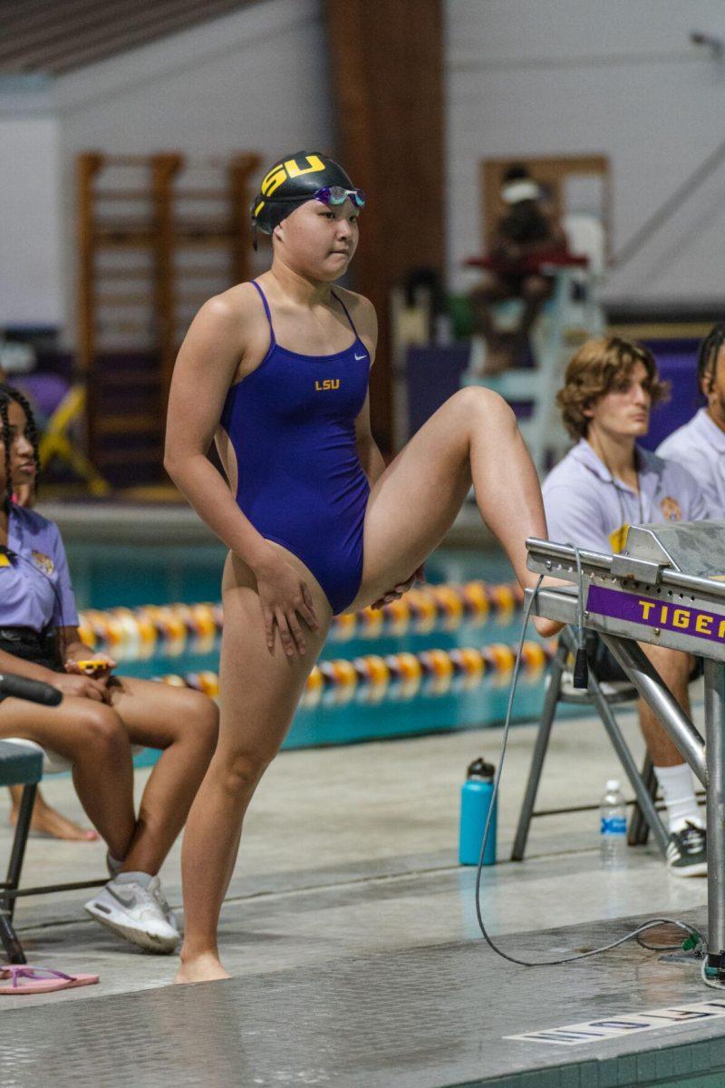 LSU swim individual medley freshman Chloe Cheng stretches before her race on Friday, Sept. 23, 2022, during LSU&#8217;s victory over Tulane and Vanderbilt at the LSU Natatorium on Nicholson Drive in Baton Rouge, La.