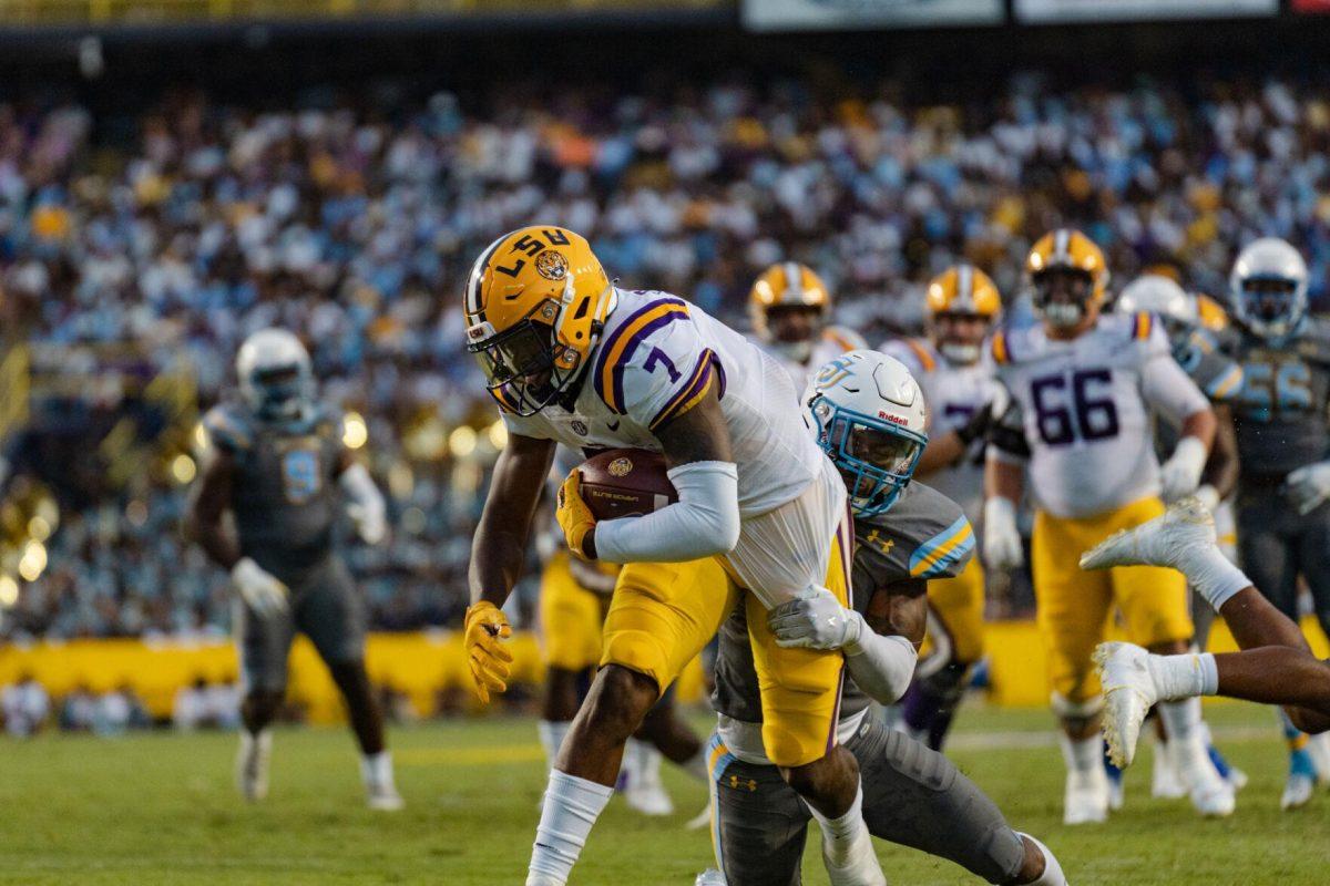 LSU football junior wide receiver Kayshon Boutte (7) powers through a tackle on Saturday, Sept. 10, 2022, during LSU&#8217;s 65-17 win over Southern at Tiger Stadium in Baton Rouge, La.