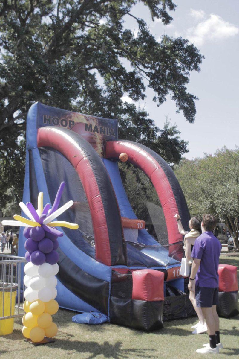 Students shoot hoops at Fall Fest on Friday, Sept. 16, 2022, on the LSU Parade Ground.