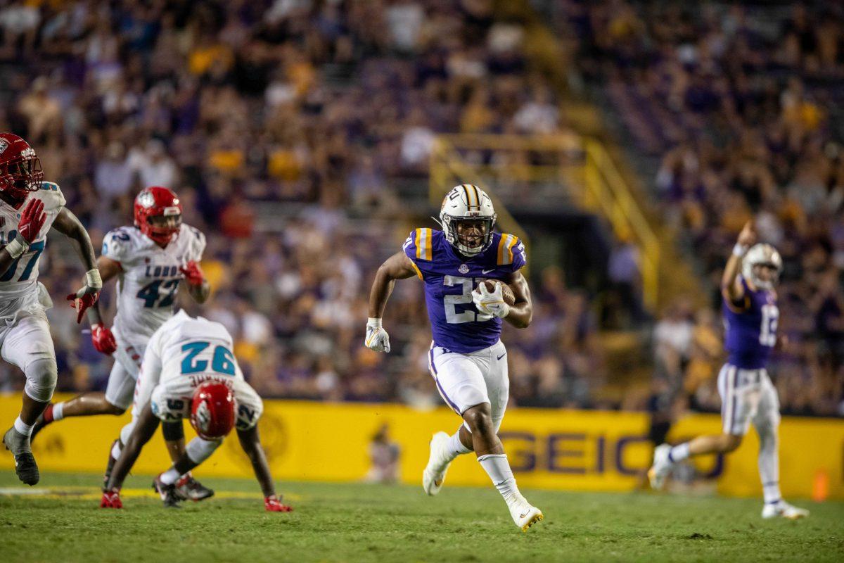 LSU football junior running back Noah Cain (21) runs the ball on Saturday, Sept. 24, 2022, during the LSU vs New Mexico game in Tiger Stadium&#160;in Baton Rouge, La.