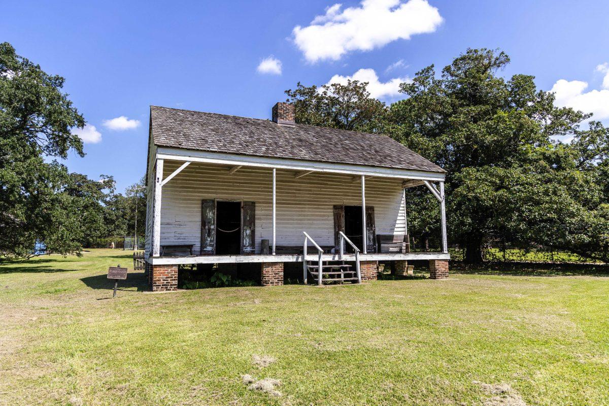 The Magnolia Plantation's slave cabin sits during a hot sun Saturday, Sept. 17, 2022 at Magnolia Mound off of Nicholson Drive.