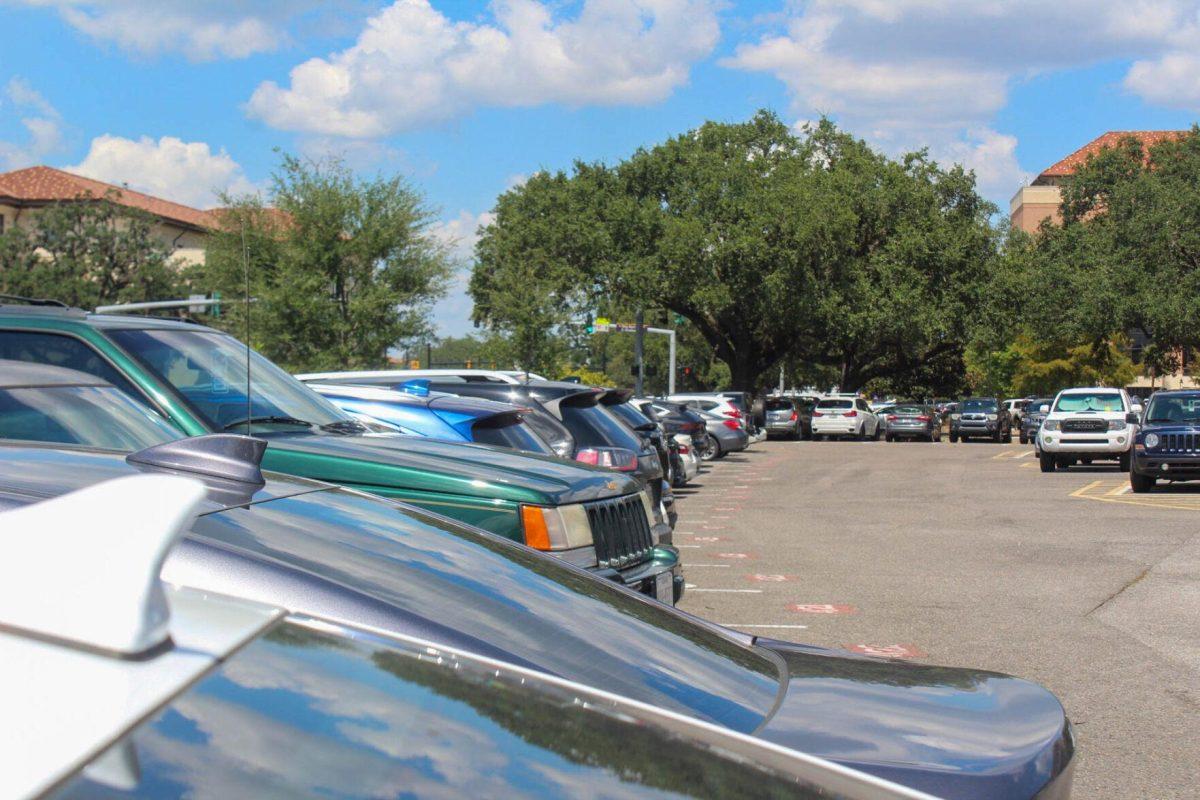 A line of commuter student's cars sits in a full parking lot on Friday, Aug. 2nd, 2022, on South Stadium Dr. next to Tiger Stadium in Baton Rouge, La.